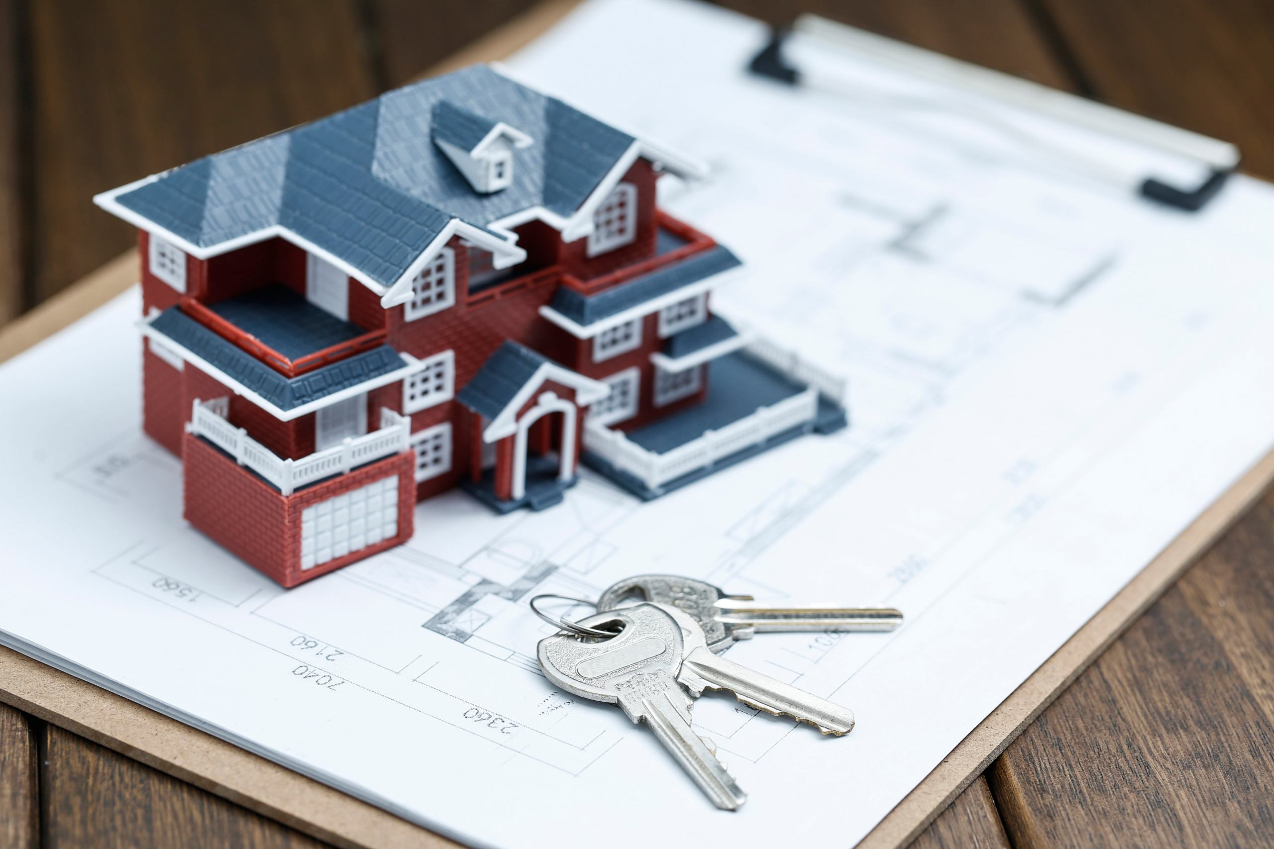 villa-house-model-key-drawing-retro-desktop-real-estate-sale-concept-min